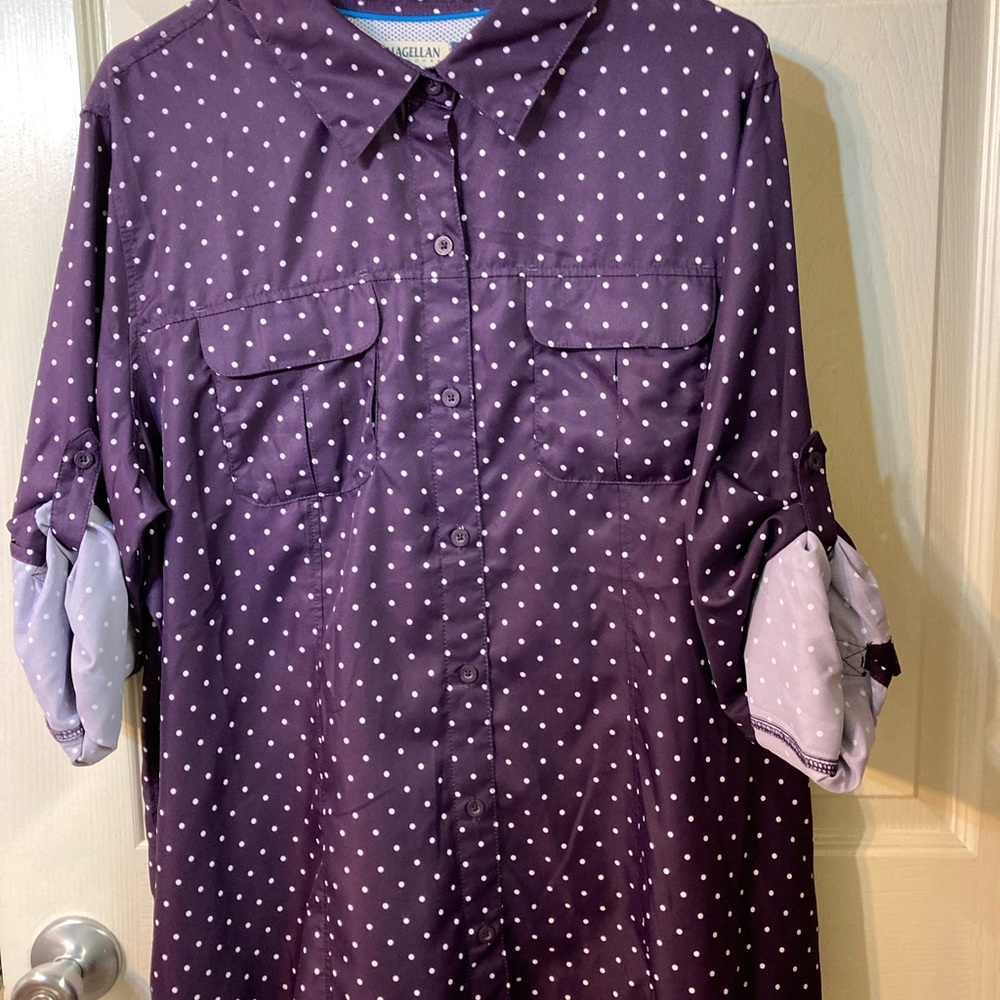 Large loose “fishing” shirt. Used as a swimsuit coverup.